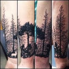 Dotwork style armband tattoo of a forest